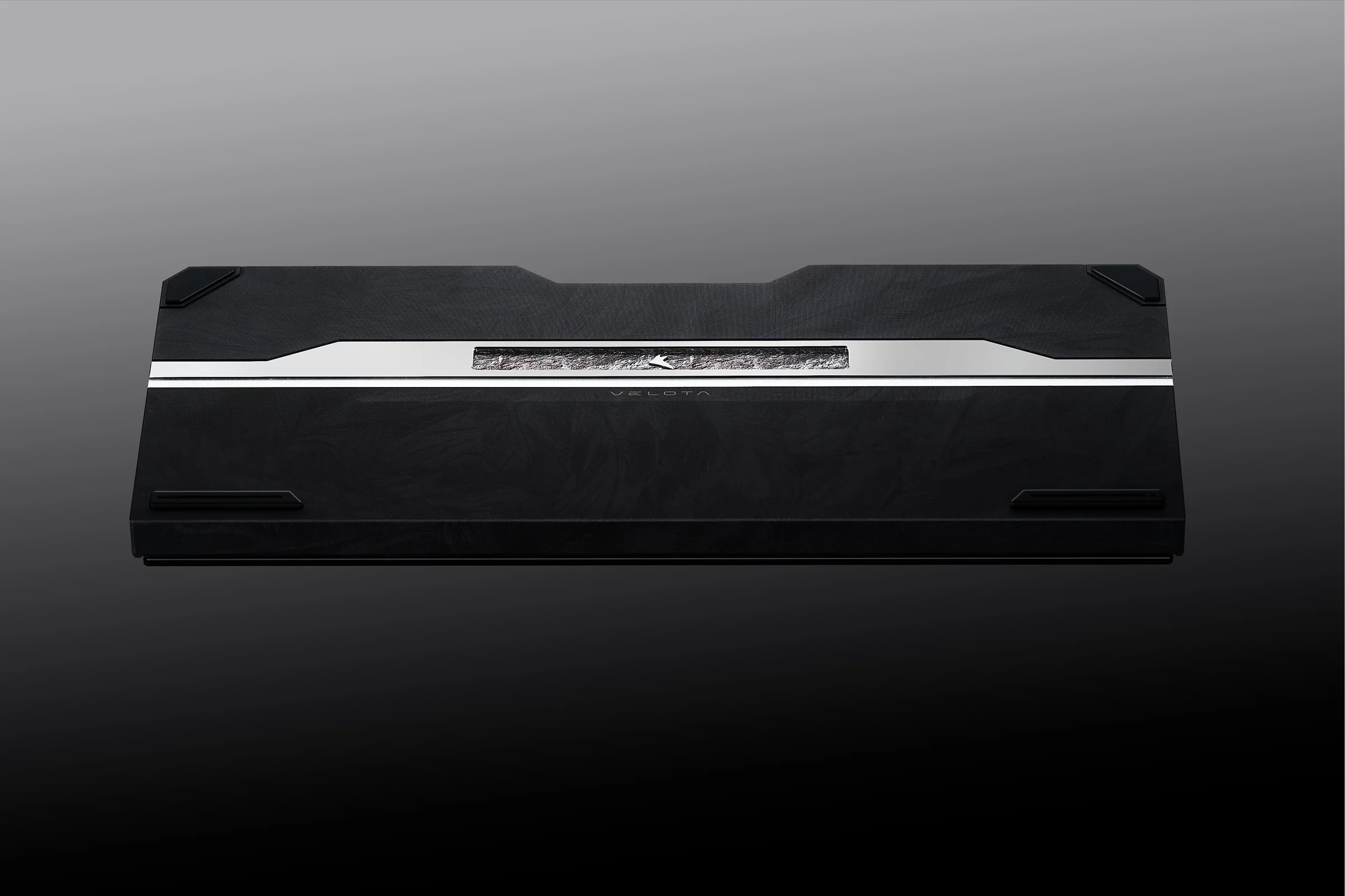 Black FUZZY 63 V2 underside with sculpted rock-textured accent and polished trim